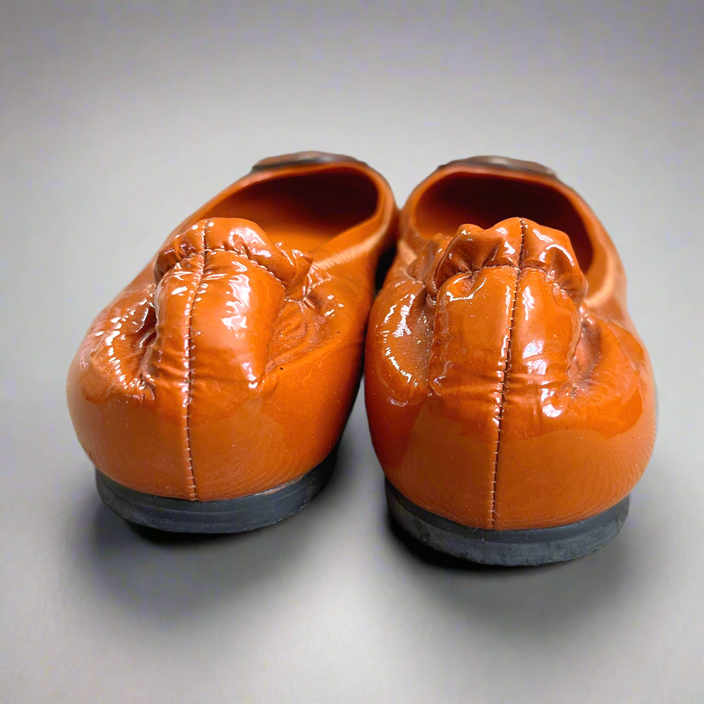 Tory Burch orange patent Reva flats, size 7