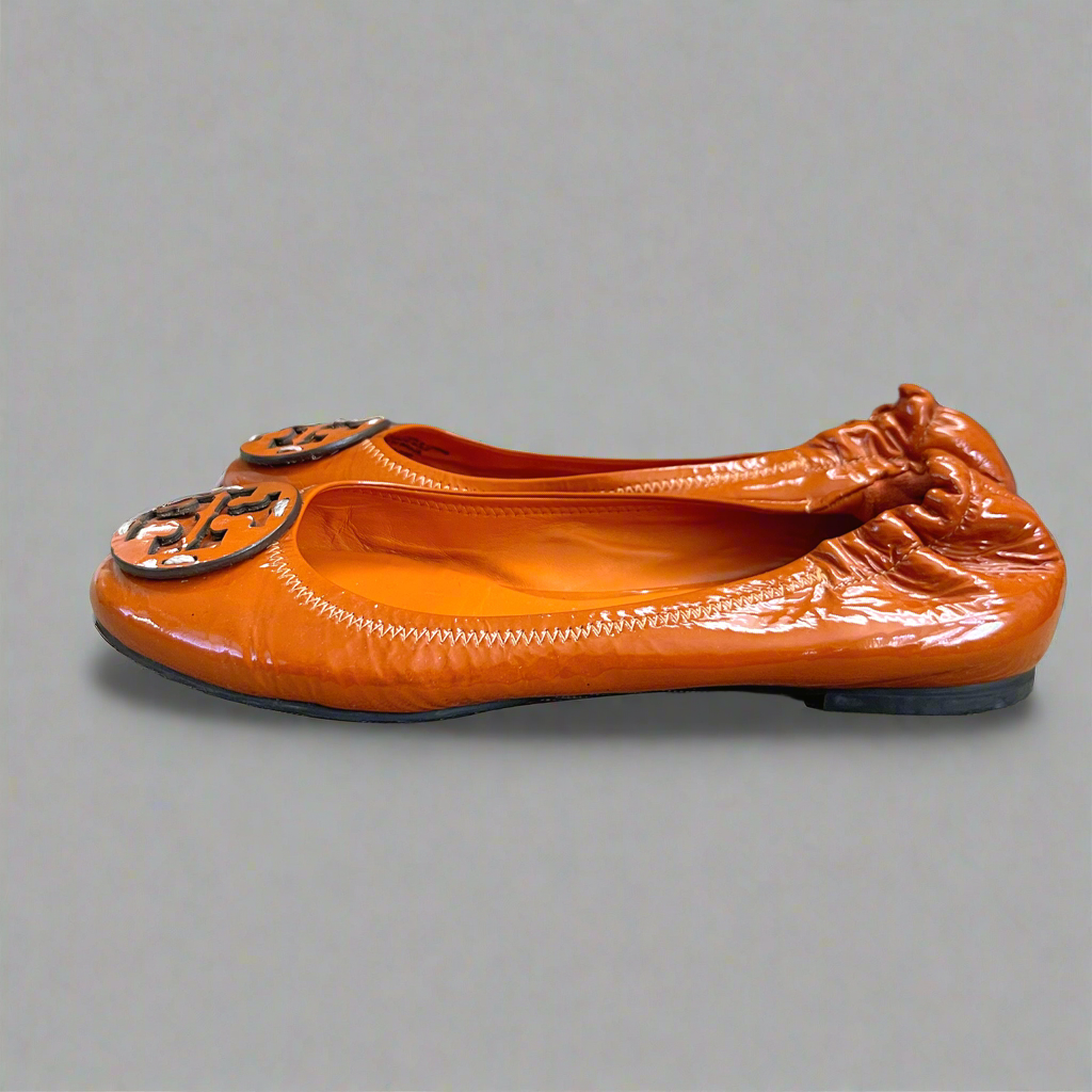 Tory Burch orange patent Reva flats, size 7
