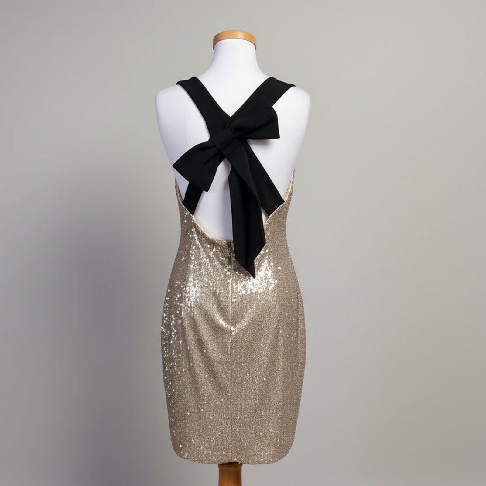 Belle Badgley Mischka gold sequin dress with black bow, size 12
