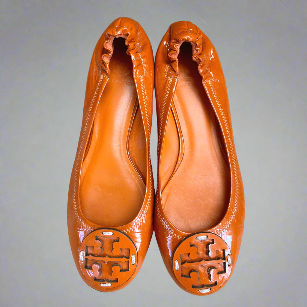 Tory Burch orange patent Reva flats, size 7